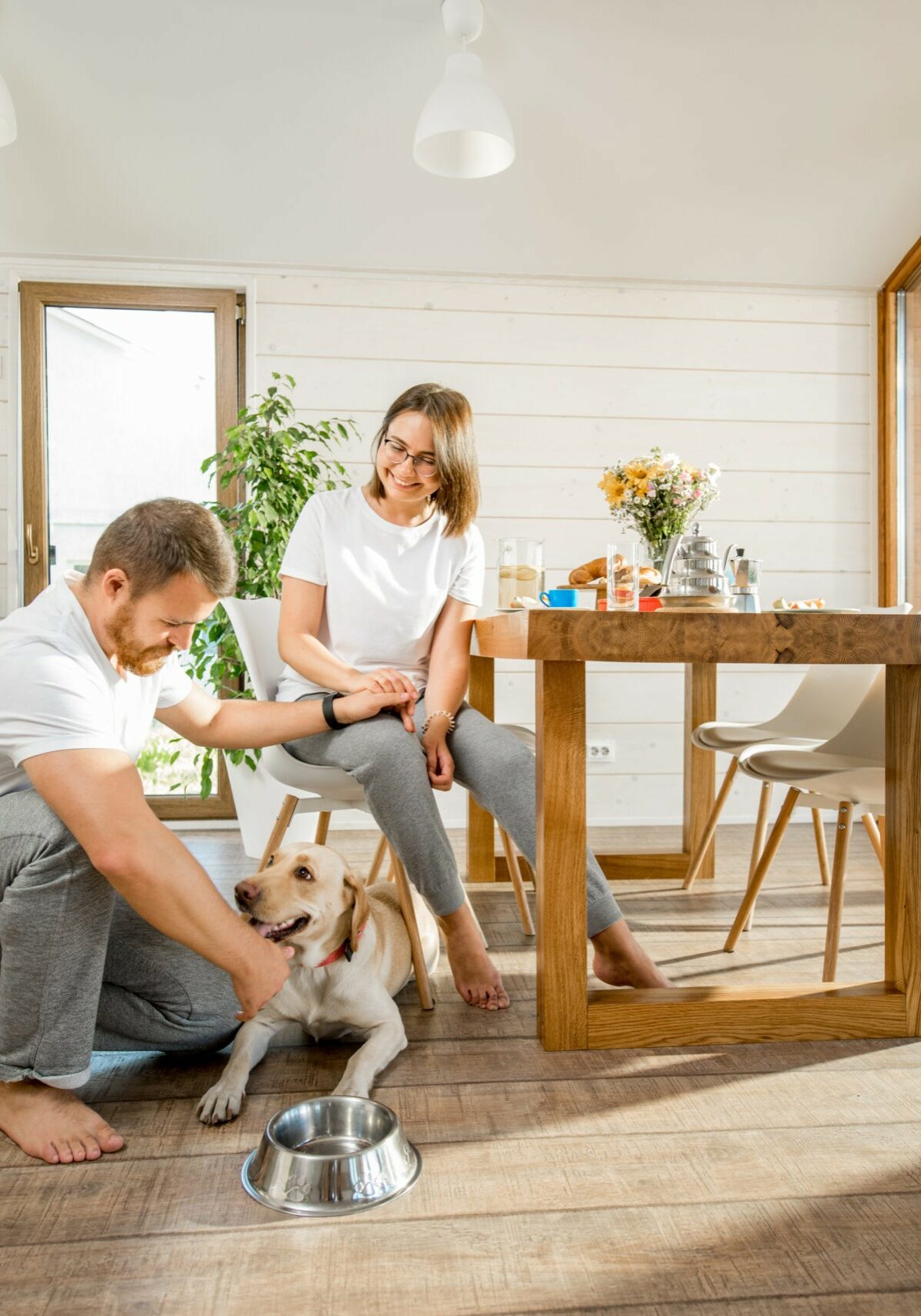 Young couple with dog at home | Five Star Flooring
